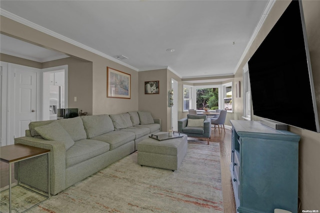 living room featuring hardwood / wood-style flooring and ornamental molding