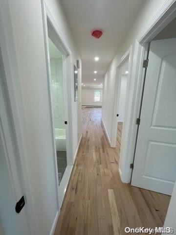 corridor featuring light hardwood / wood-style flooring