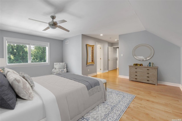 bedroom with wood-type flooring, ceiling fan, and lofted ceiling