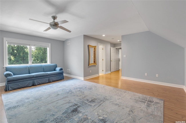 unfurnished living room featuring ceiling fan, light hardwood / wood-style floors, and lofted ceiling