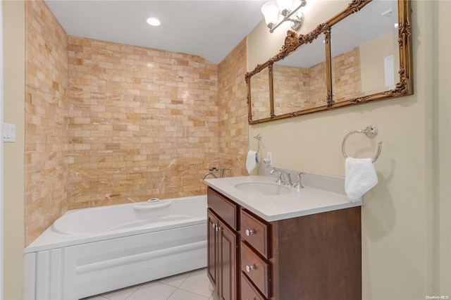 bathroom featuring tile patterned floors, a tub to relax in, vanity, and tile walls