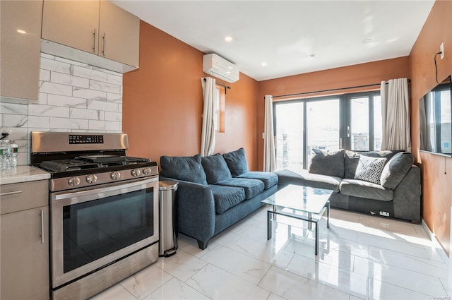 kitchen with french doors, stainless steel range with gas cooktop, backsplash, and an AC wall unit