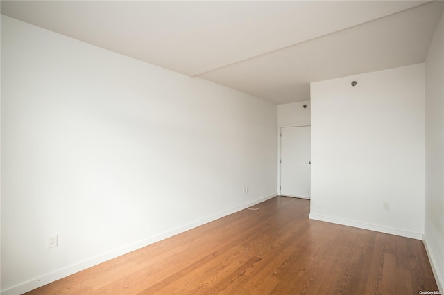 spare room featuring hardwood / wood-style floors