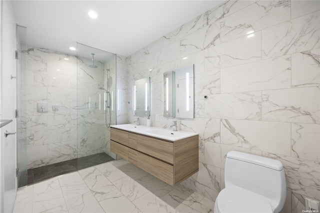 bathroom featuring tiled shower, toilet, tile walls, and vanity