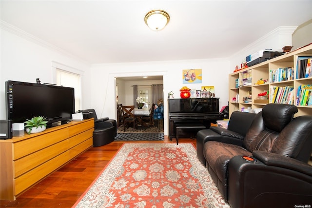 living room with hardwood / wood-style flooring and ornamental molding