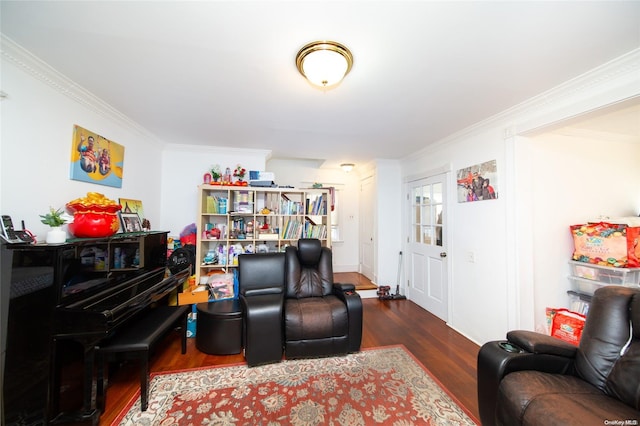 sitting room featuring ornamental molding and dark wood-type flooring