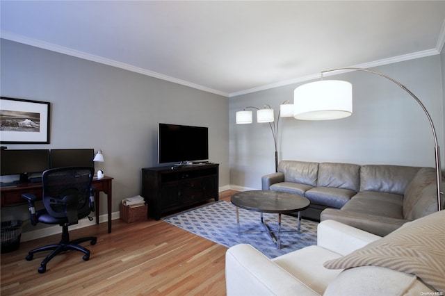 living room featuring ornamental molding and light wood-type flooring