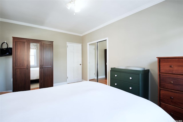 bedroom with wood-type flooring and ornamental molding