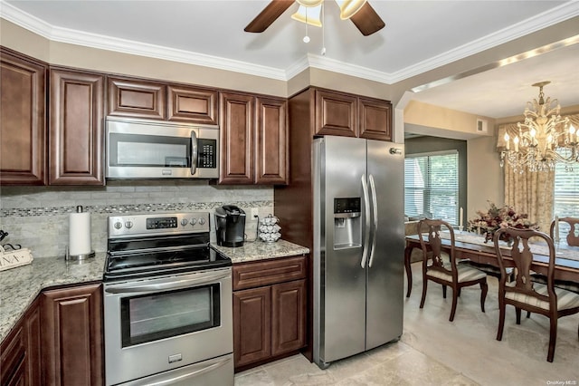 kitchen featuring light stone countertops, backsplash, and appliances with stainless steel finishes