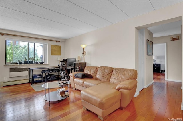 living room with hardwood / wood-style flooring and a baseboard radiator