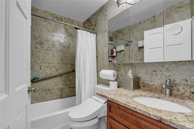 full bathroom with vanity, toilet, and shower / bath combo