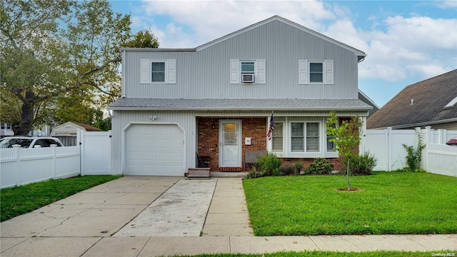 view of front facade with a front yard and a garage