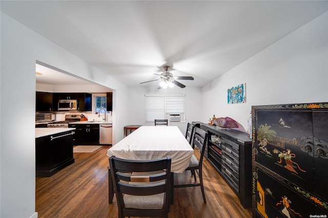 dining space featuring ceiling fan, cooling unit, and dark hardwood / wood-style floors