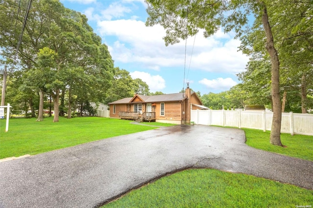 49 Concord Rd, Shirley, NY 11967 - view of front of house featuring driveway and a wooden deck