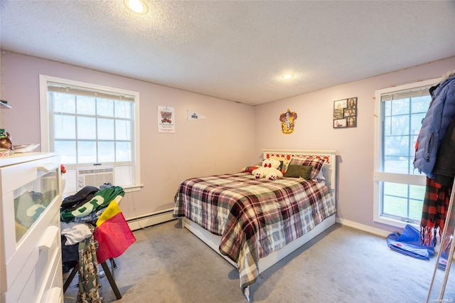 49 Concord Rd, Shirley, NY 11967 - carpeted bedroom with a baseboard radiator, a textured ceiling, multiple windows, recessed lighting, and baseboards