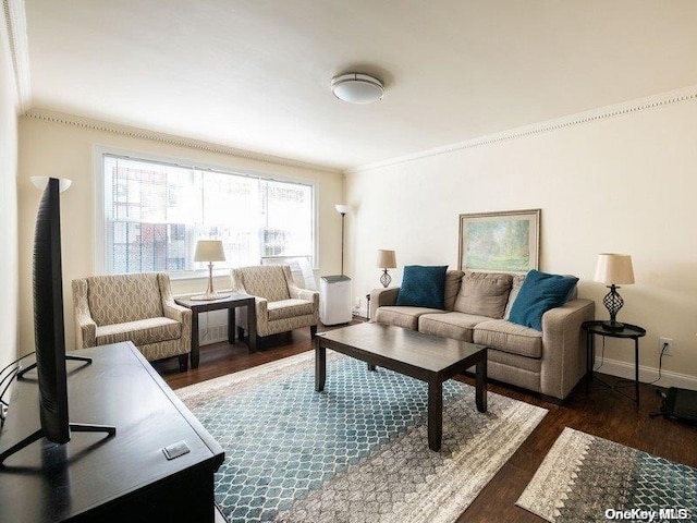 living room with dark hardwood / wood-style floors and ornamental molding