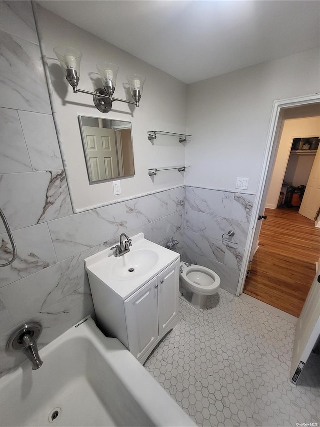 bathroom with hardwood / wood-style flooring, vanity, toilet, and tile walls