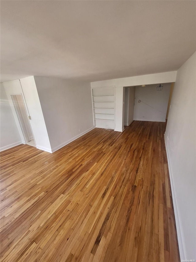 unfurnished living room featuring light wood-type flooring