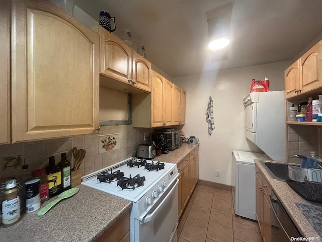 kitchen featuring decorative backsplash, light brown cabinetry, white appliances, light tile patterned floors, and stacked washer and clothes dryer