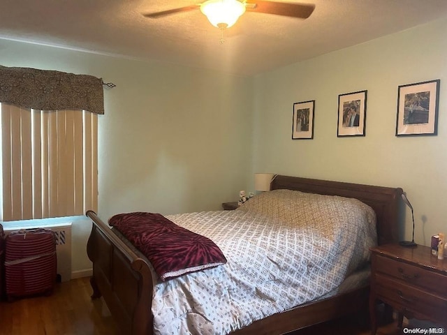 bedroom featuring ceiling fan and wood-type flooring