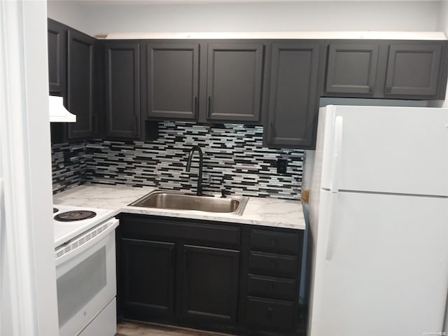 kitchen featuring decorative backsplash, white appliances, sink, and extractor fan