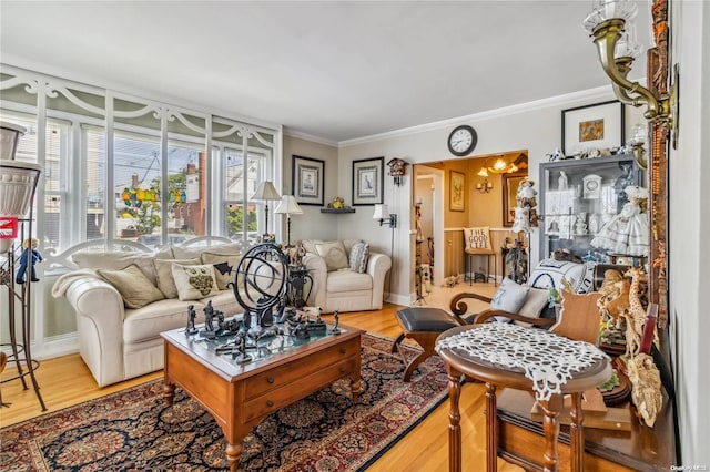 living room with crown molding and hardwood / wood-style flooring