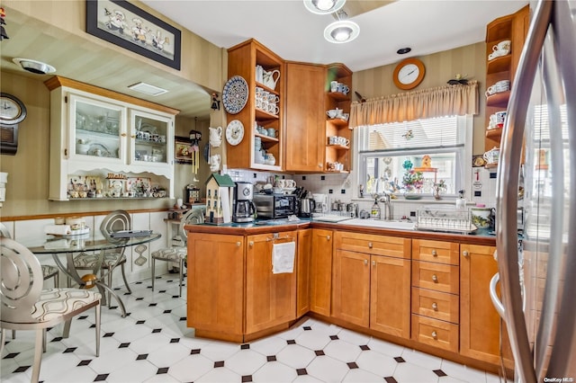 kitchen with decorative backsplash and sink