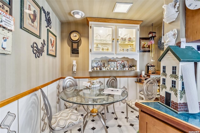 dining area with light tile patterned floors