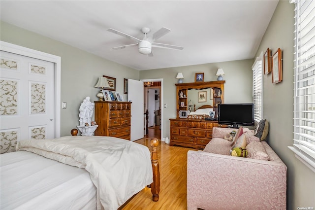 bedroom featuring ceiling fan and light hardwood / wood-style flooring