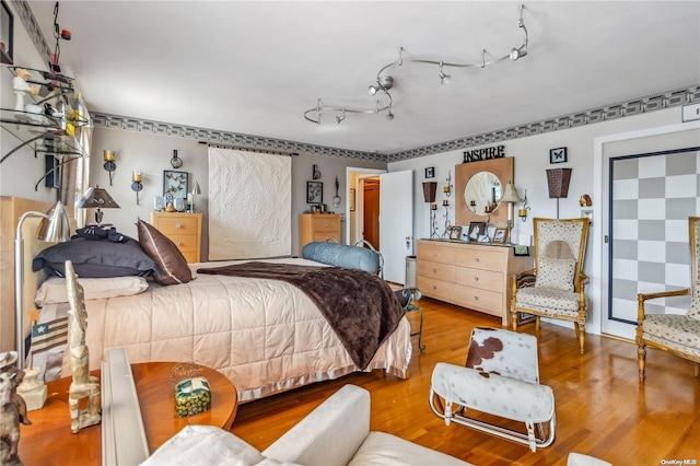 bedroom with hardwood / wood-style flooring