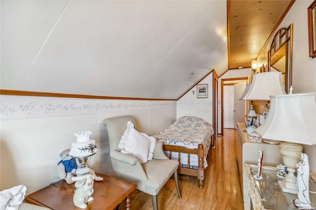 living area featuring light hardwood / wood-style flooring and lofted ceiling