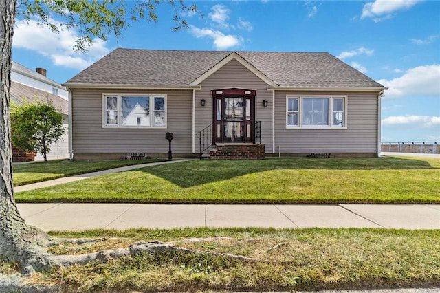 bungalow-style house featuring a front yard