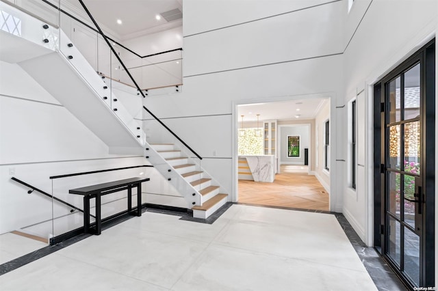 staircase featuring ornamental molding