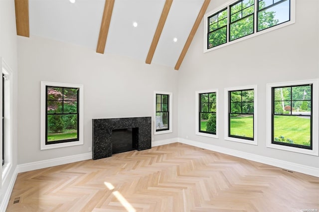 unfurnished living room featuring a fireplace, high vaulted ceiling, a healthy amount of sunlight, and beamed ceiling