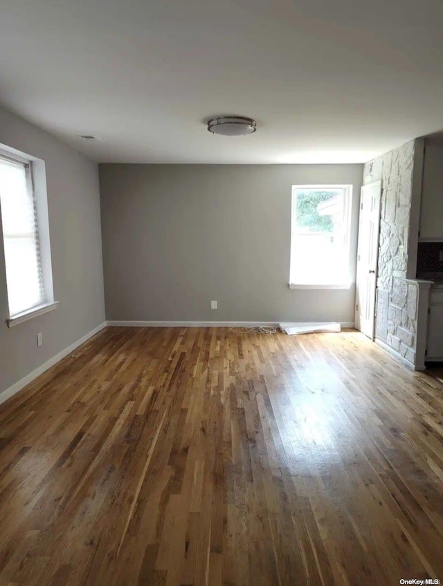 empty room with wood-type flooring