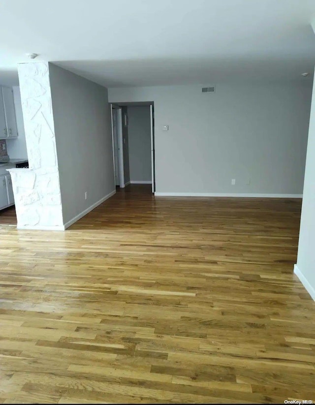 unfurnished living room with light wood-type flooring