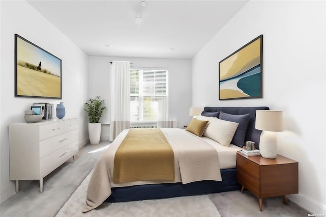 bedroom with light colored carpet