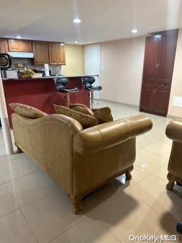 living room with light tile patterned floors