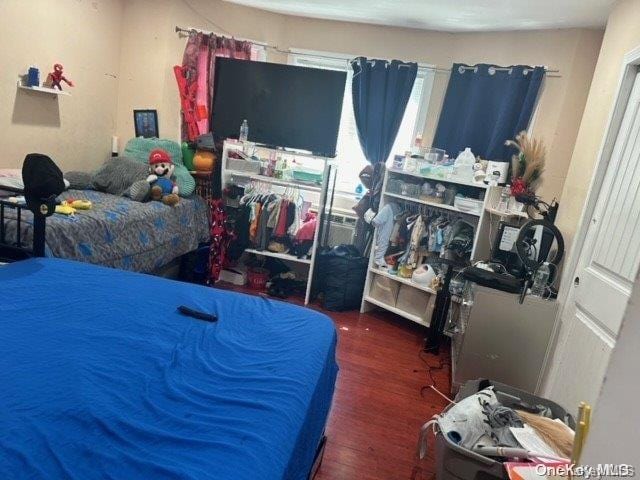 bedroom featuring dark hardwood / wood-style flooring