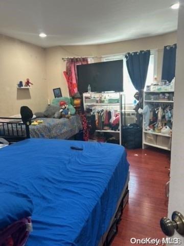 bedroom featuring dark hardwood / wood-style floors