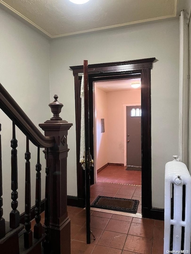 staircase featuring tile patterned flooring