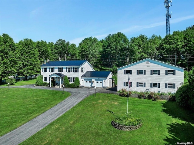 765 Sheep Pen Rd, Call Listing Agent, NY 13849 - view of front facade featuring driveway, a front lawn, and an attached garage