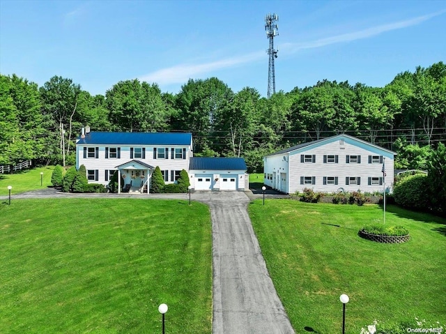 765 Sheep Pen Rd, Call Listing Agent, NY 13849 - colonial house featuring an outbuilding, a front yard, and a detached garage
