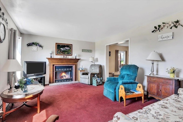 carpeted living room with a brick fireplace