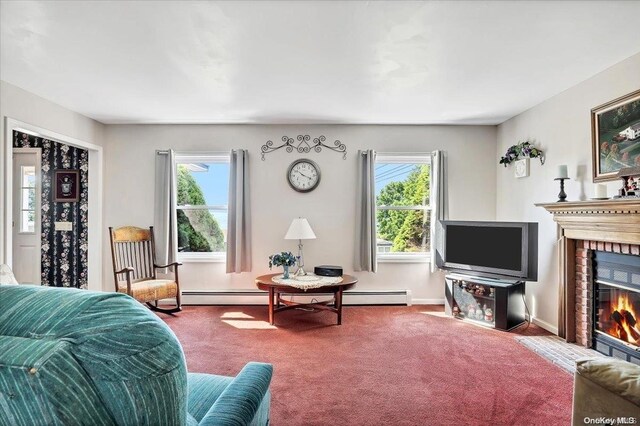 carpeted living room with a wealth of natural light and a fireplace