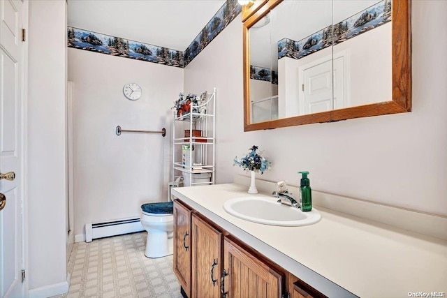 765 Sheep Pen Rd, Call Listing Agent, NY 13849 - bathroom featuring a baseboard heating unit, tile patterned floors, vanity, toilet, and a shower