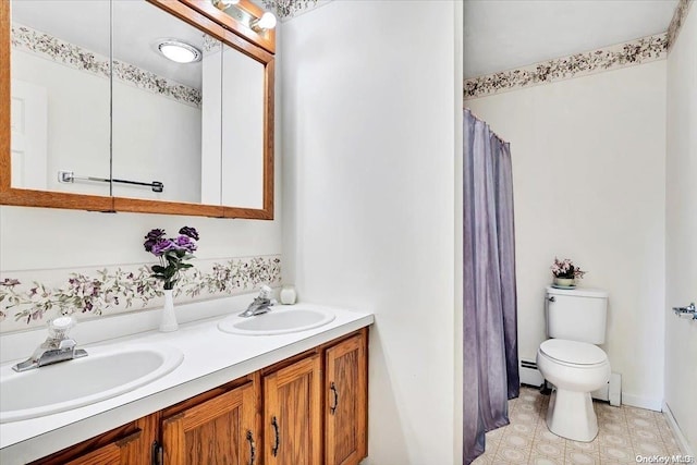 765 Sheep Pen Rd, Call Listing Agent, NY 13849 - bathroom featuring toilet, baseboard heating, double vanity, and curtained shower
