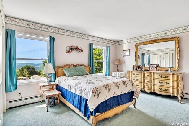 bedroom featuring carpet floors and baseboard heating