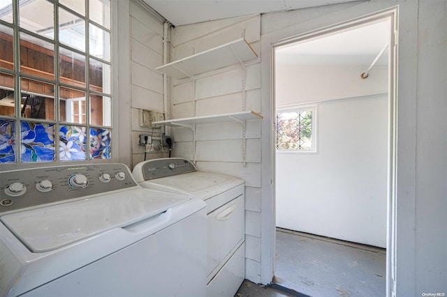 clothes washing area featuring washing machine and clothes dryer