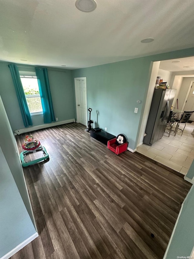 interior space featuring dark hardwood / wood-style floors and a baseboard radiator